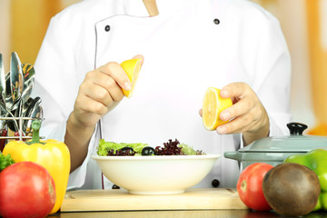 Cook hands prepare salad