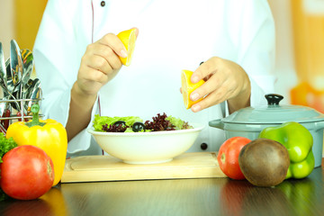 Cook hands prepare salad