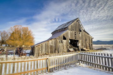 Rustic old weathered barn in the winter © knowlesgallery