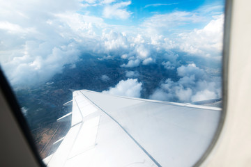 Looking through window aircraft during flight in wing