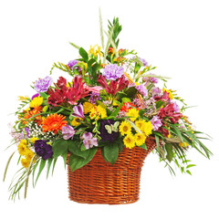 Flower bouquet in wicker basket isolated on white