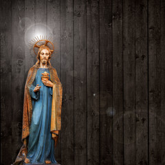 jesus christ statue wooden background