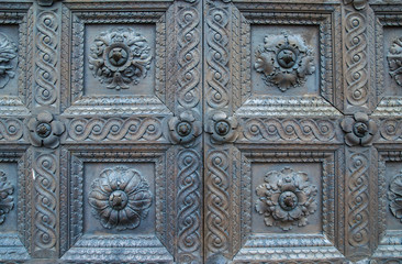 Old door with wooden decorations