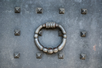 ld door with knocker in the form of simple iron ring
