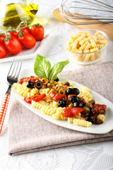 Pasta with olives, capers and tomatoes