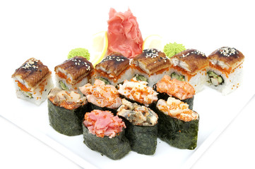 Japanese rolls in a restaurant with fish and vegetables