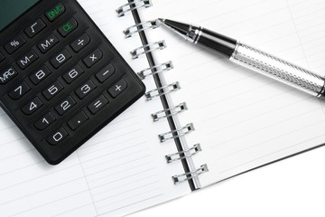 calculator notebook and business pen