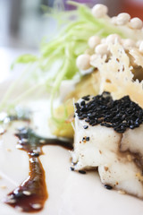 Closeup of fish steak with vegetable 