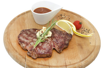 Beef steak cooking on the grill