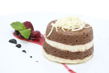 cream dessert garnished with mint on a white background