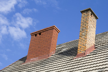 two brick chimneys on the roof