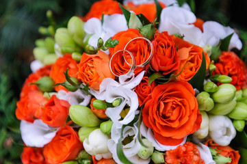 Wedding rings on a bouquet of roses