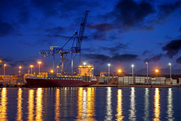Container ship on loading in the port of Gdansk, Poland.
