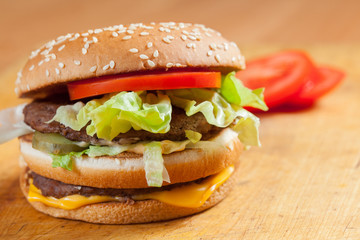 Delicious hamburgers on a wooden table