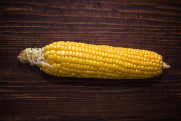 Ear of corn on wooden background