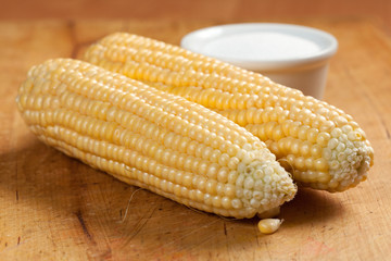Corn on the cob on a white plate