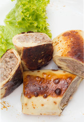 Pancake with meat with salad on white dish