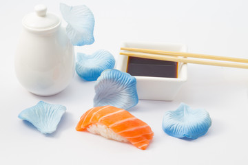 Fototapeta na wymiar Salmon sushi nigiri with soy sauce and chopsticks