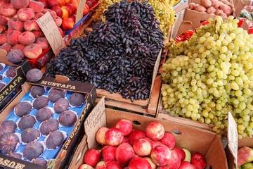 Fruit at market with price tags for sale