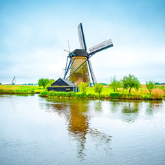 Naklejka premium Windmill and canal in Kinderdijk, Holland or Netherlands.