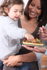 Family eating cake together