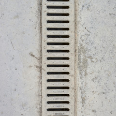 Drain grate in concrete floor