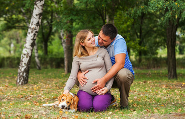 Happy couple of future parents on the walk