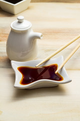 Soy sauce and bottle with chopsticks