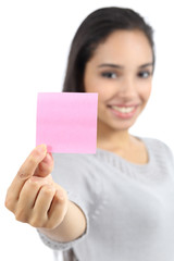 Beautiful woman showing a blank pink paper note