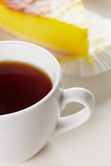 Tea and cake on white a
