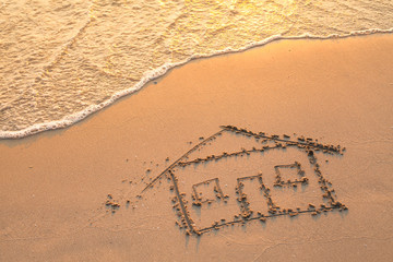 House painted on beach sand. - obrazy, fototapety, plakaty