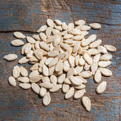 Wax gourd seeds on a wooden spoon