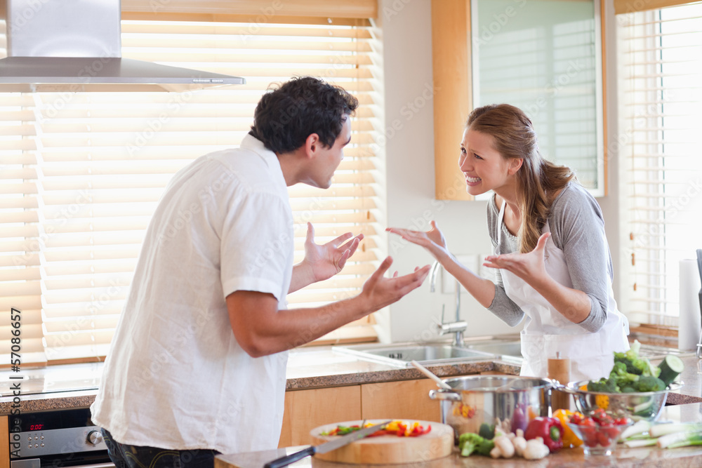 Wall mural couple having a fight in the kitchen