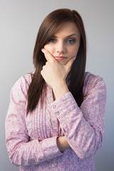 Pensive classy brunette posing