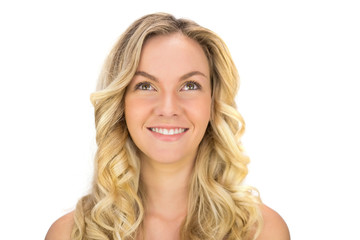Naklejka premium Happy curly haired blonde posing