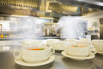 Fototapeta na wymiar Bowls filled with hot soup