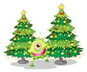 A monster dancing in front of the christmas trees