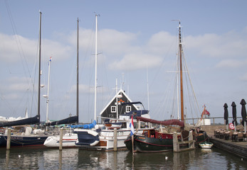 Fototapeta na wymiar Sailing ships in the harbour of Marken