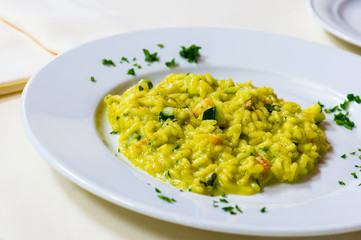 delicious risotto with saffron and  parsley leaves