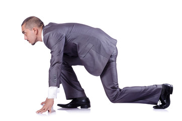 Businessman ready for race isolated on white