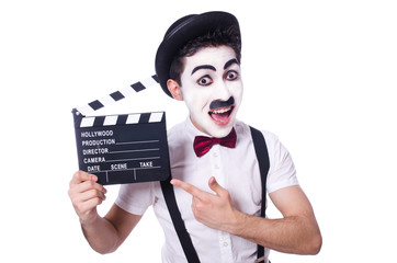 Man with movie clapper isolated on white