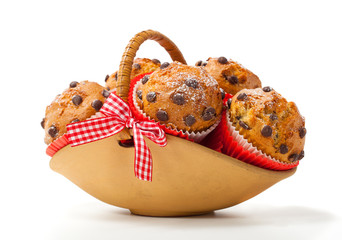 Muffins in a basket isolated on white background