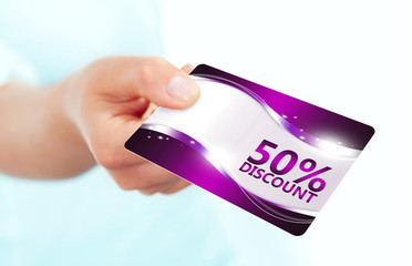 hand holding red discount card isolated over white