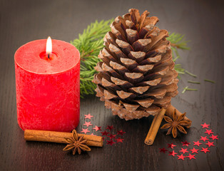 Fototapeta na wymiar Christmas decoration: fir sprig,candles, cones
