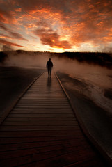 Fototapeta premium Sunrise Yellowstone Geysers with Man Silhouetted