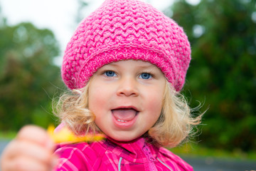 girl is showing fall-leaf