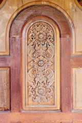 Form of art, carved wooden doors of Thailand.