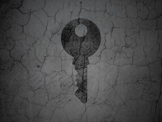 Security concept: Key on grunge wall background