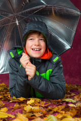 happy boy with umbrella
