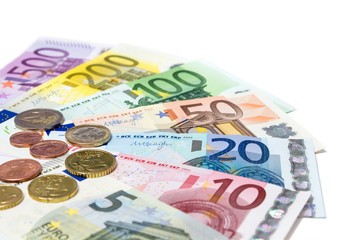 coins and banknotes euro on white - in perspective